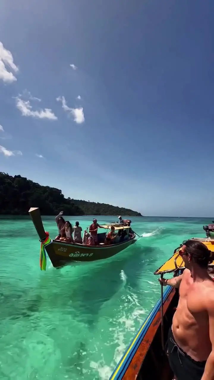 Longtail boat on turquoise water